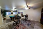 Fully finished and furnished basement w/ pool table, gathering area, and HDTV